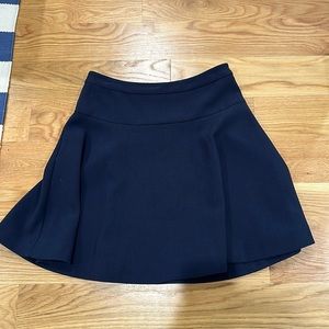 Likely; navy skirt